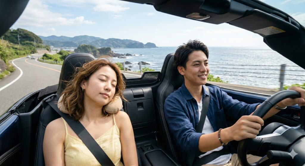 オープンカーの助手席で眠る女